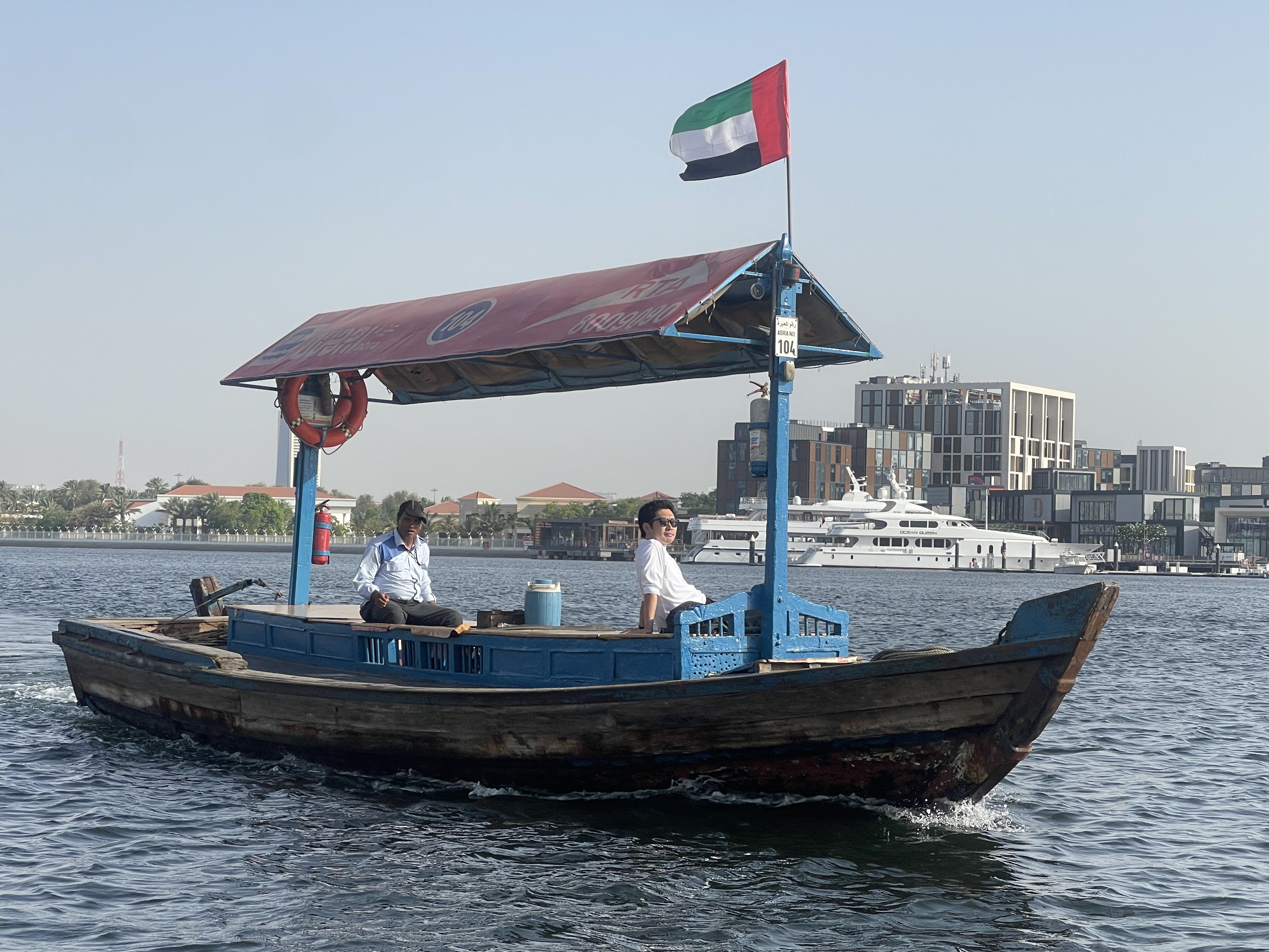 An Abra (A type of boat) on the water, Dubai Creek - Dubai, UAE.